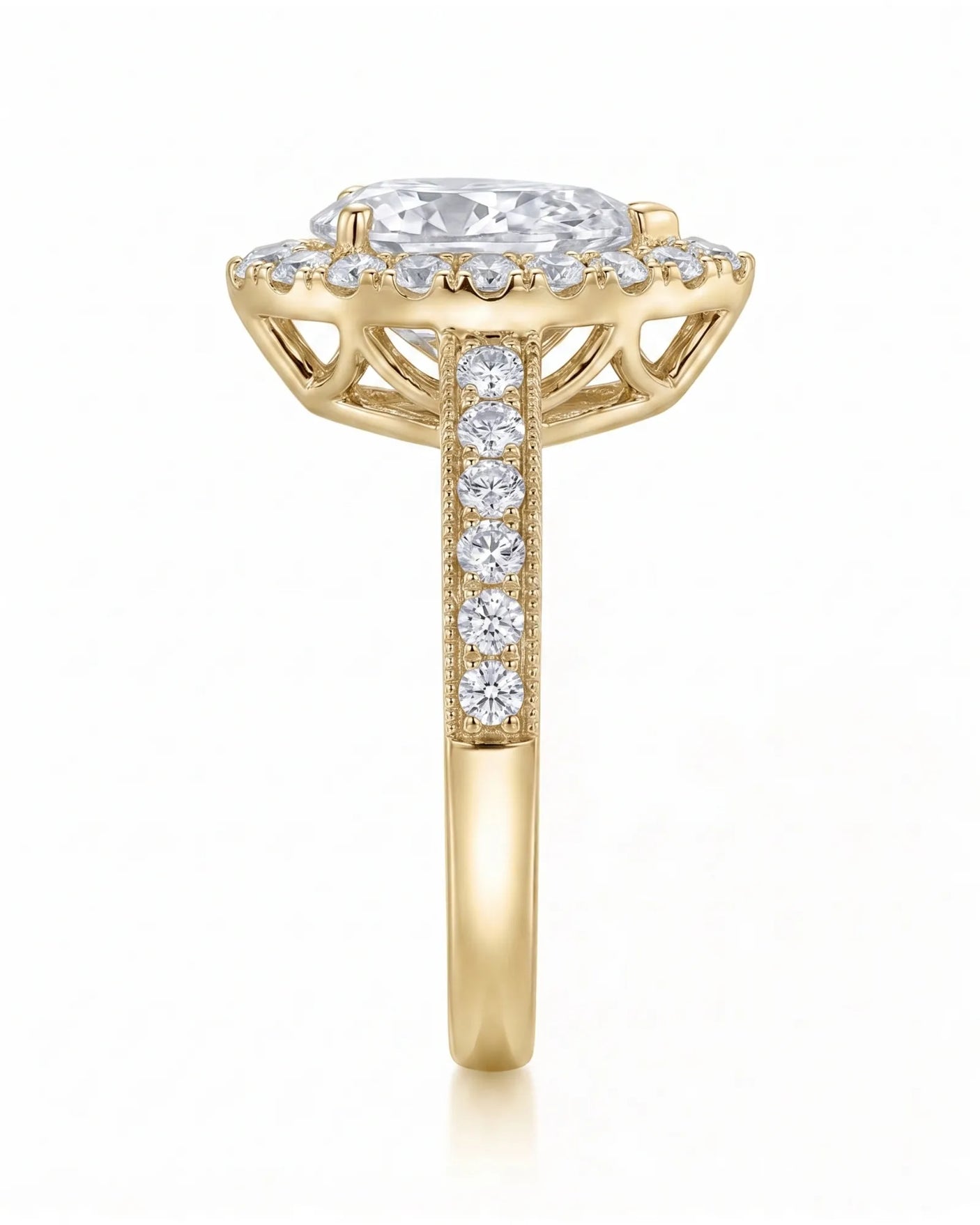 ROSE 1 carat F-colour pear natural diamond halo ring in 18K yellow gold, side profile showing raised halo gallery | SARATTI