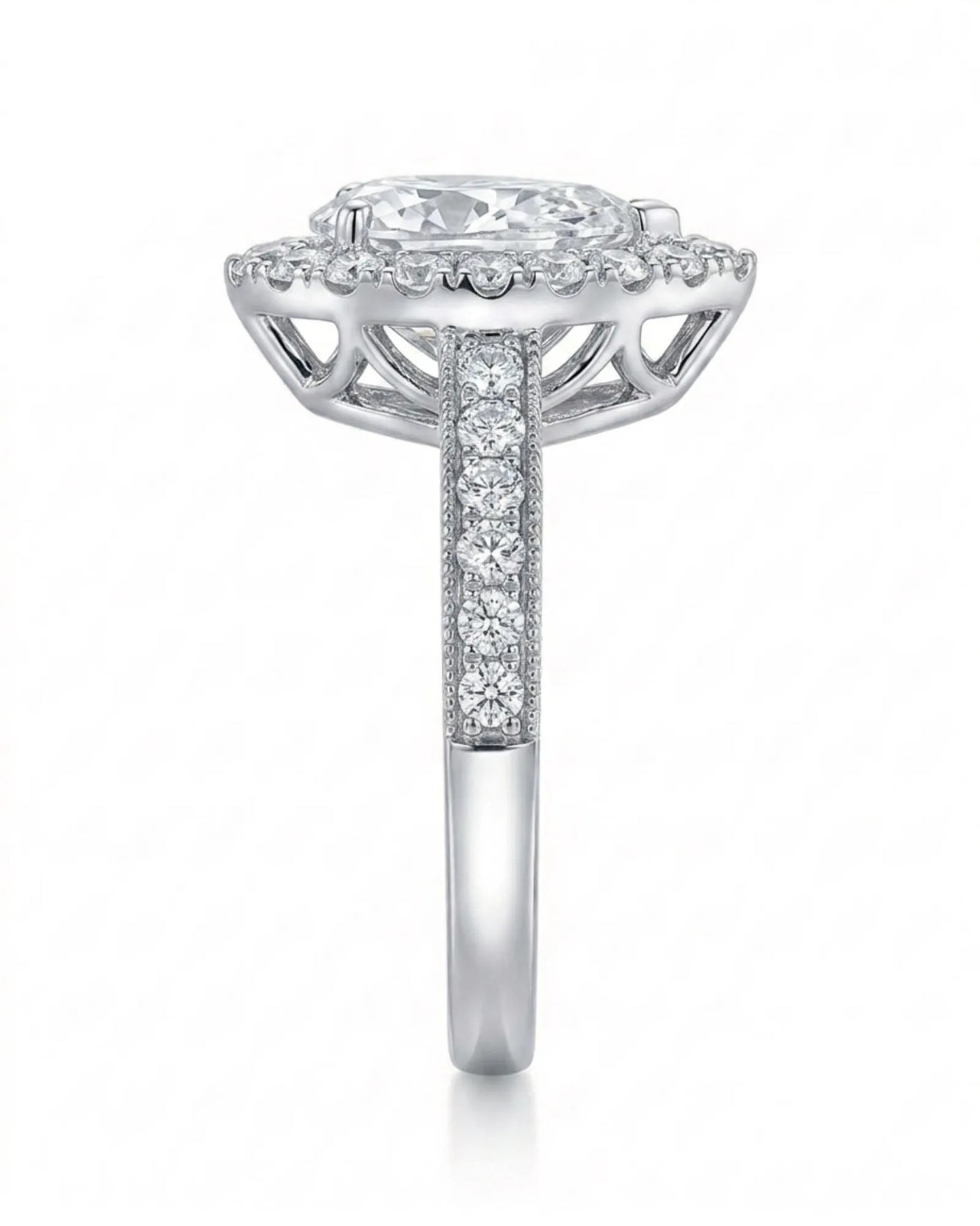 ROSE 1 carat F-colour pear natural diamond halo ring in platinum, side profile showing raised halo gallery | SARATTI