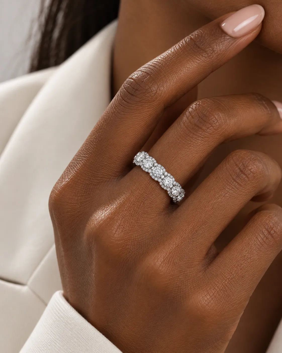 Round diamond cluster wedding band in platinum worn on the hand | SARATTI
