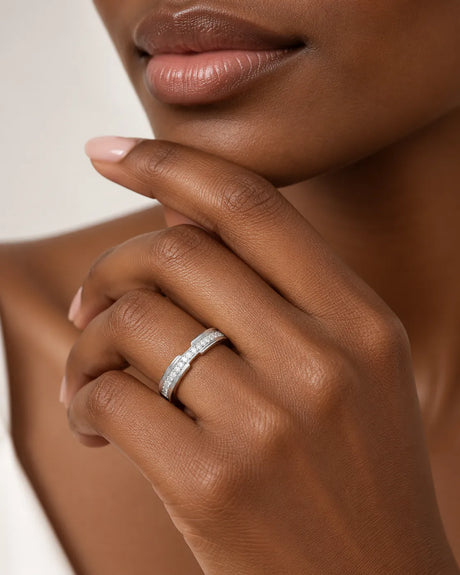 Round diamond wedding band in 18K white gold worn on hand | SARATTI
