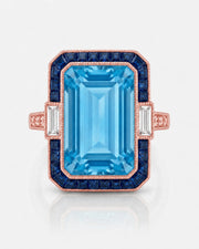 Saphira Line emerald-cut Aquamarine ring setting in rose gold, front view with blue sapphire halo and baguette side diamonds | SARATTI