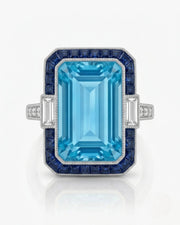 Saphira Line emerald-cut Aquamarine ring setting in white gold, front view with blue sapphire halo and baguette side diamonds | SARATTI