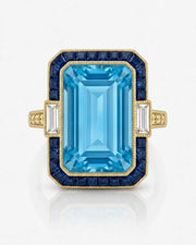 Saphira Line emerald-cut Aquamarine ring setting in yellow gold, front view with blue sapphire halo and baguette side diamonds | SARATTI