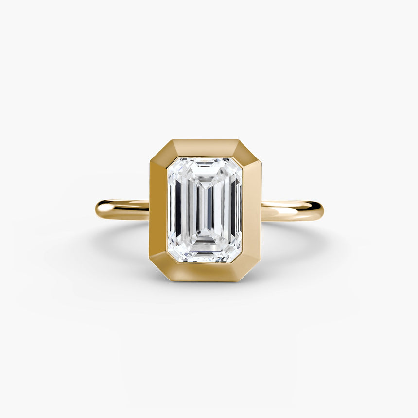 SOLARA Emerald Cut bezel-set solitaire ring setting in Yellow Gold | SARATTI