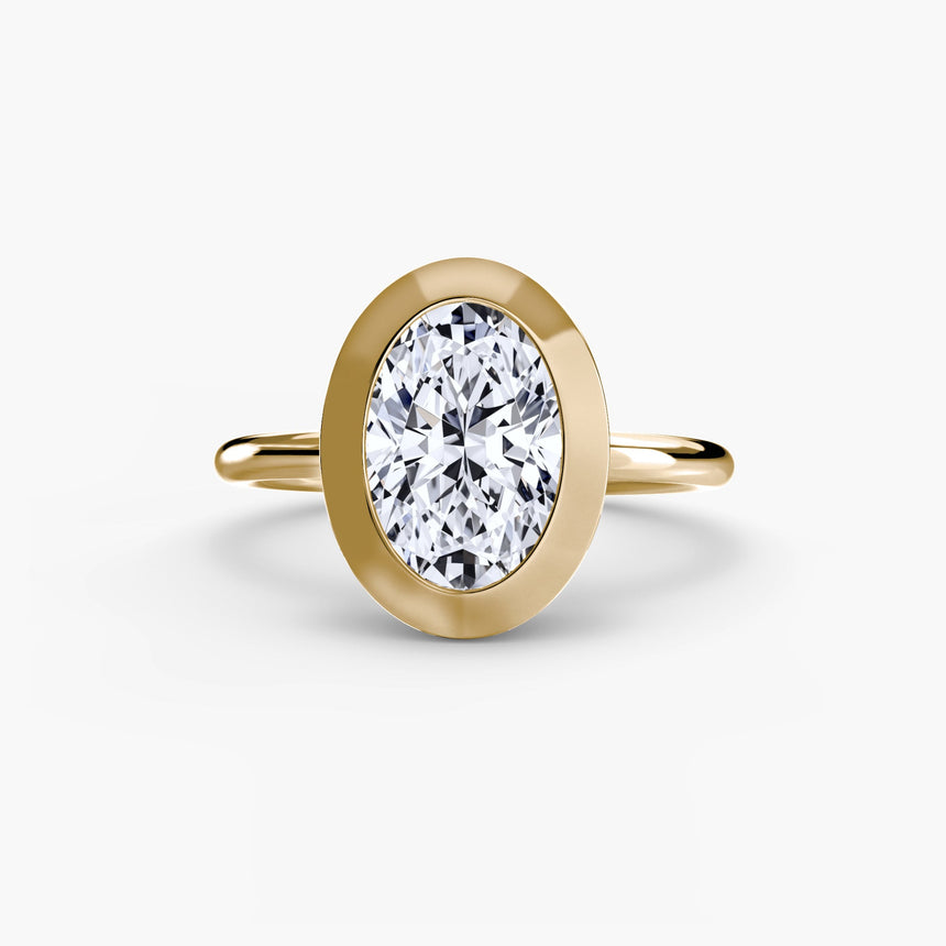 SOLARA Oval Cut bezel-set solitaire ring setting in Yellow Gold | SARATTI