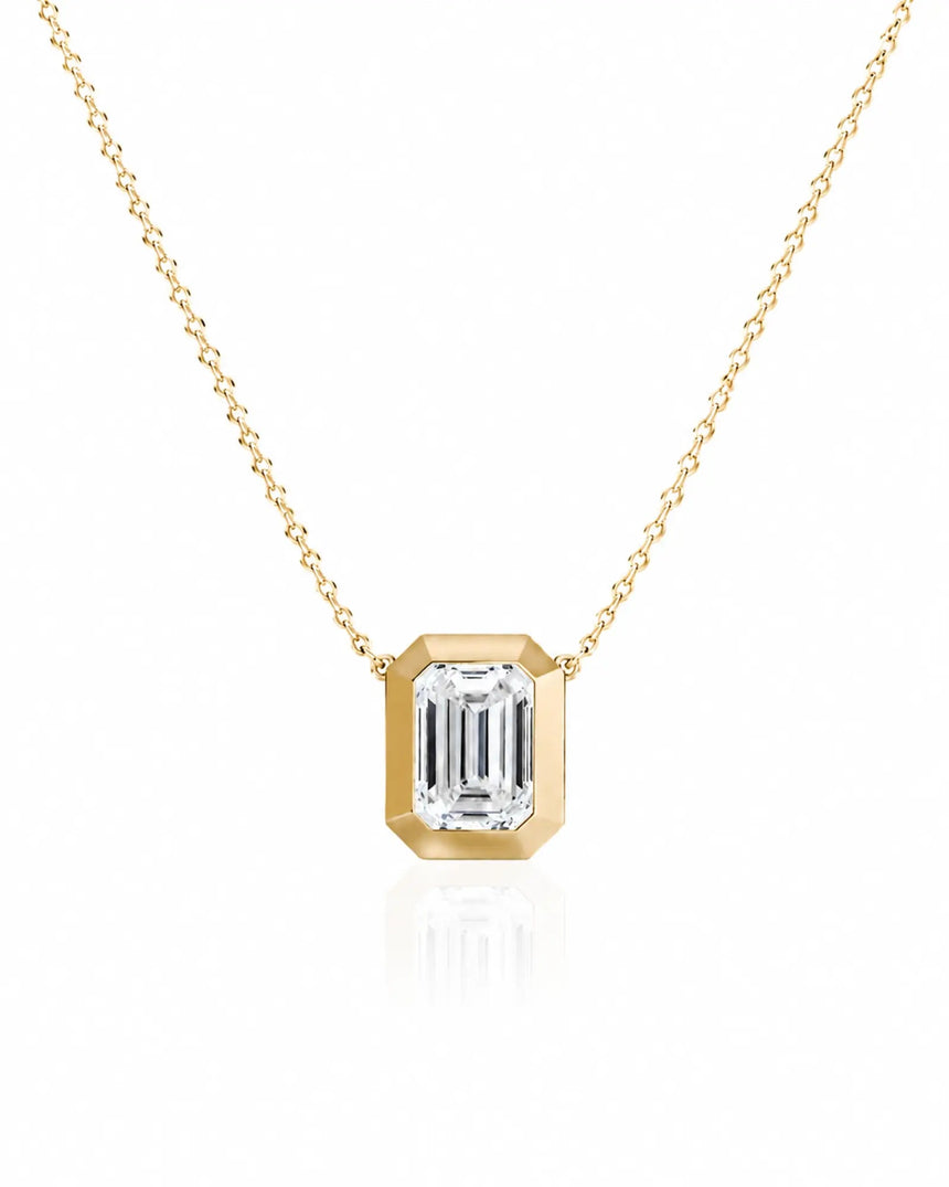 SOLARA Bezel-Set Emerald Cut solitaire necklace setting in yellow gold, front view | SARATTI