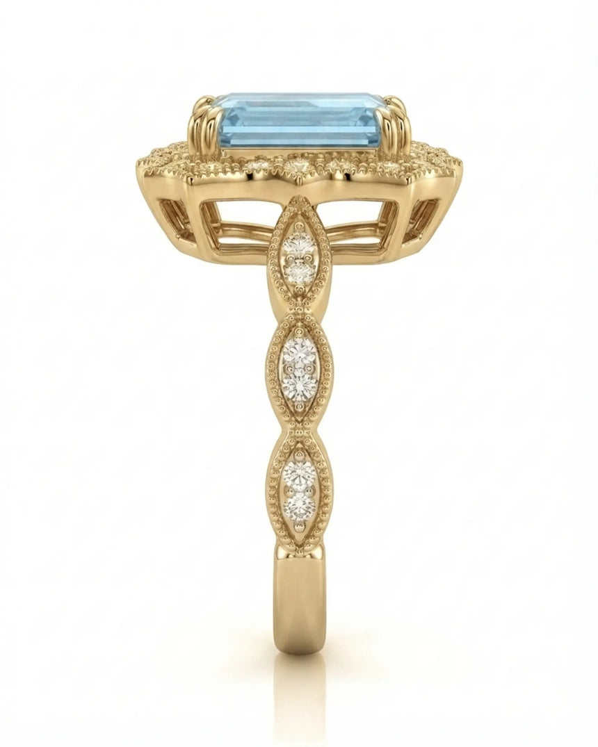Valoria Crest emerald-cut Aquamarine ring setting in yellow gold, side profile with open crown gallery and diamond links | SARATTI