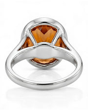 white gold Imperial Topaz oval bezel ring with open shoulders | SARATTI