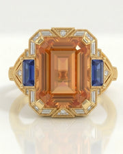 yellow gold Imperial Topaz setting with blue sapphire side accents | SARATTI