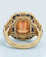 yellow gold emerald cut Topaz setting with sapphire fan shoulders | SARATTI