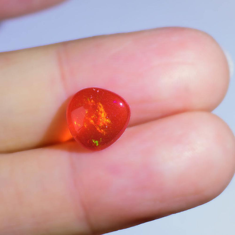 Orange Opal in Human Hand | Saratti