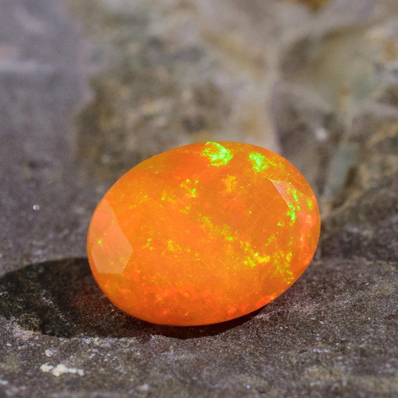 Glowing Orange Opal against Natural Background | Saratti