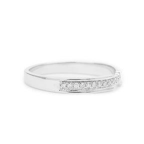 Thin Wedding Band with Channel Set Diamonds in 18K White Gold against White Background Lying Down | Modern Gem Jewelry | Saratti