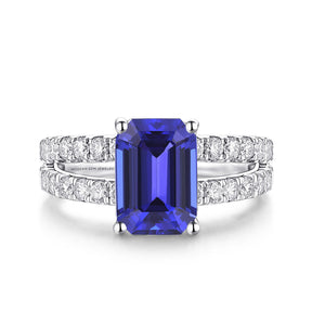 Emerald Cut Tanzanite Ring with Pave Set Diamonds | 5 carat Heirloom Tanzanite Ring on White Background | Modern Gem Jewelry | Saratti
