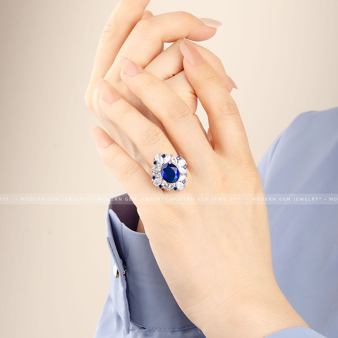 Oval Royal Blue Cocktail Ring in 18K White Gold on Woman's Finger | Saratti 