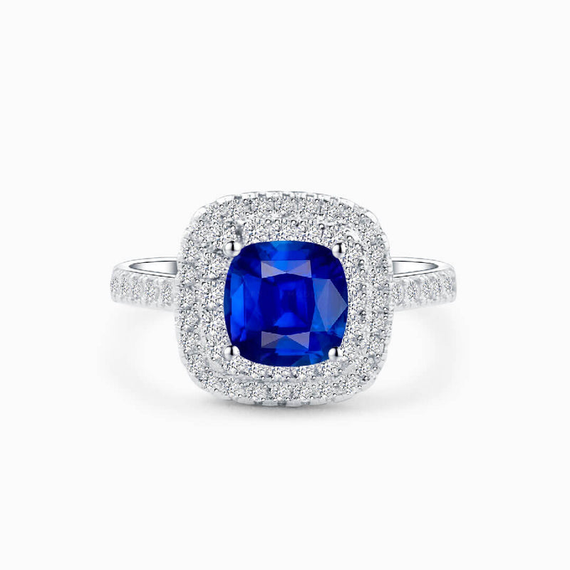 Gorgeous Halo Sapphire Ring against White Background - Sapphire Engagement Ring Settings and Styles for 2023 - Saratti