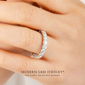 Cushion Cut Diamond Eternity Wedding Band in 18K White Gold on Woman's Finger | Modern Gem Jewelry | Saratti 