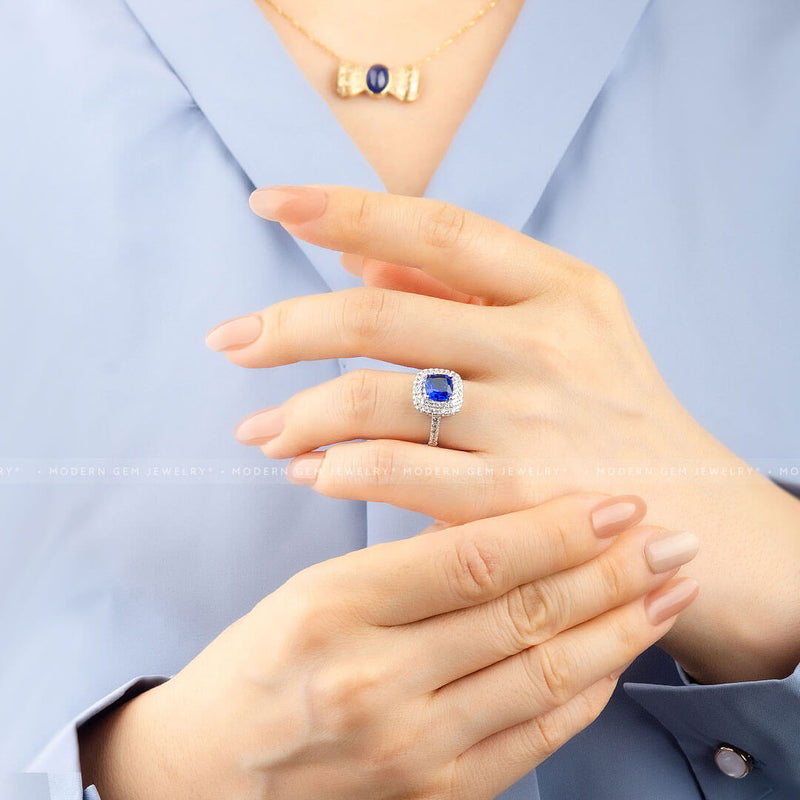 Gorgeous Halo Sapphire Ring against on Model’s Finger - Sapphire Engagement Ring Settings and Styles for 2023 – Saratti