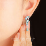 Model wears rose gold apatite and tanzanite earrings