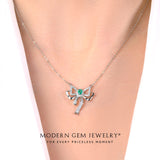 Oval Emerald and Diamonds 18K White Gold Necklace on Woman | Modern Gem Jewelry 