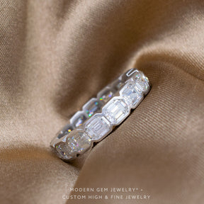 Bezel Set Wedding Band For Emerald Cut Engagement Ring in White Gold on Silk Sheets | Modern Gem Jewelry | Saratti 