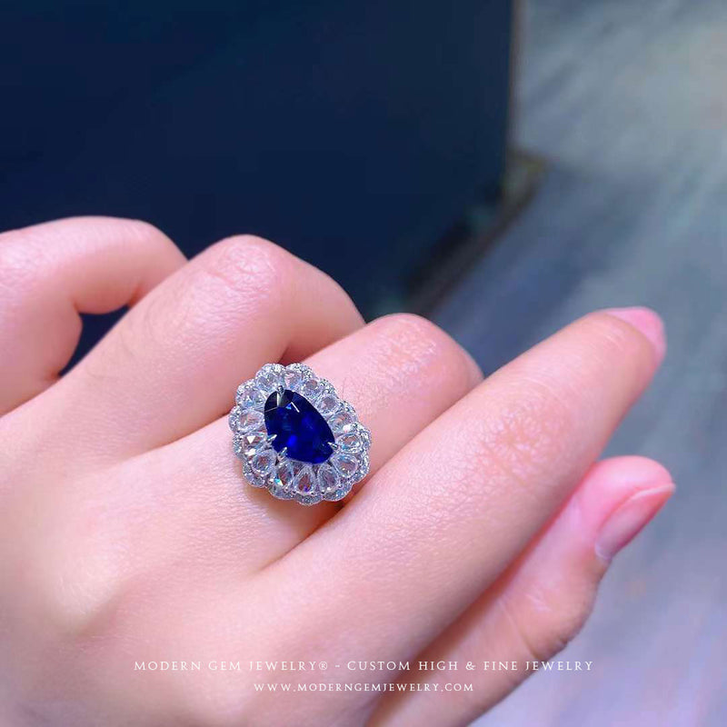 Unique Cut Royal Blue Sapphire Ring on Model’s Finger - Sapphire Engagement Ring Settings and Styles for 2023 – Saratti