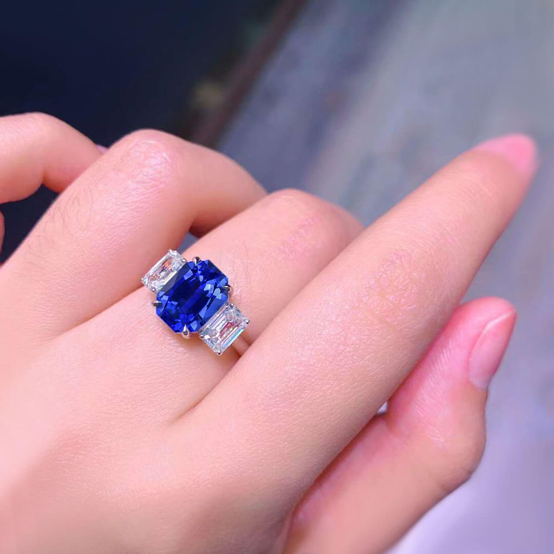 Three Stone Emerald Cut Sapphire Diamond on Woman's Finger Close Shot | Ring Modern Gem Jewelry | Saratti 