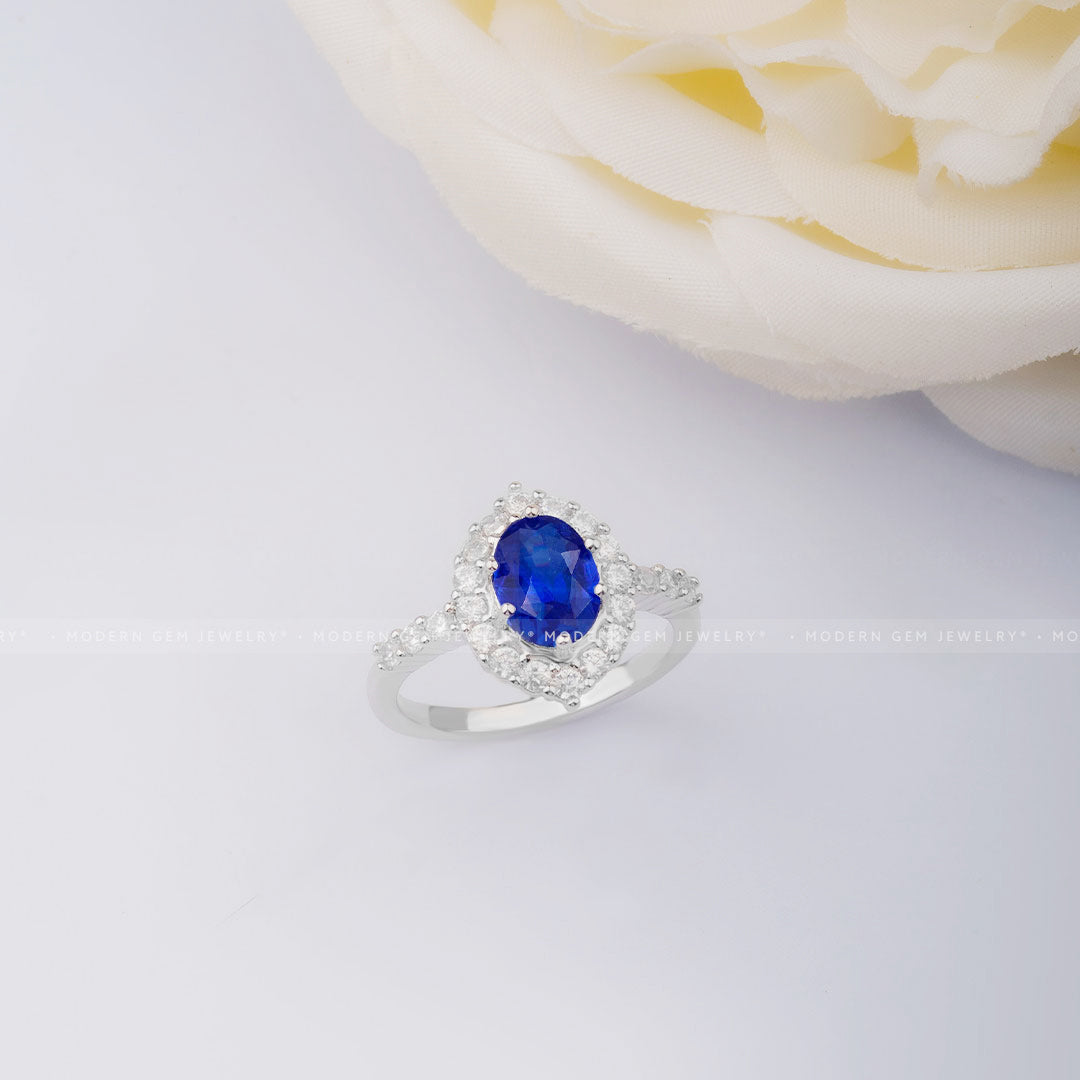 Impressive Oval Blue Sapphire and Diamond Halo White Gold Ring | Modern Gem Jewelry | Saratti