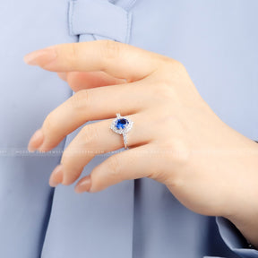 Elegant Oval Blue Sapphire and Diamond Halo White Gold Ring | Modern Gem Jewelry | Saratti
