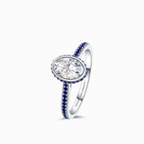 Oval Moissanite Ring with Blue Natural Sapphires in 18K White Gold | Modern Gem Jewelry