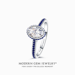 Oval Moissanite Ring with Blue Natural Sapphires in 18K White Gold Bezel Set | Modern Gem Jewelry