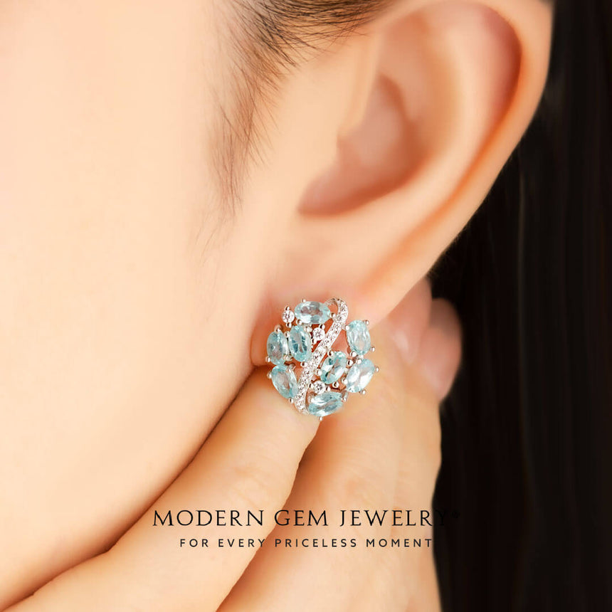 Model wears natural apatite and diamond pave earrings 