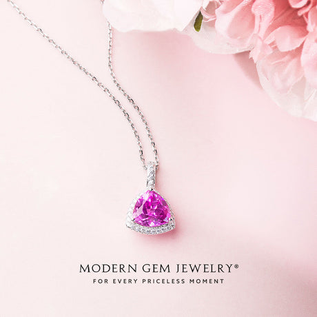 Sakura Henzo Pink Topaz Necklace against a pink flower backdrop | Saratti