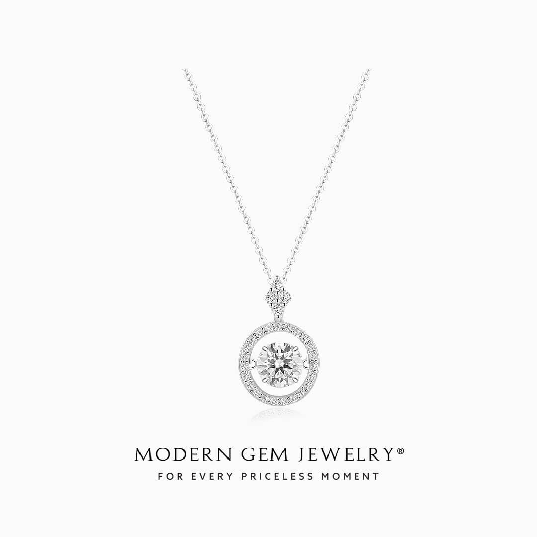 Diamond Circle Necklace with Center Diamond held by Four Prongs with accent diamonds around the center stone. Set in 18K White Gold | Modern Gem Jewelry