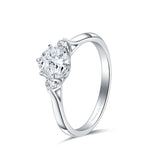 Minimalist three stone round diamond engagement ring