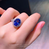 Oval Blue Sapphire High End Engagement Ring on Hand - Modern Gem Rings