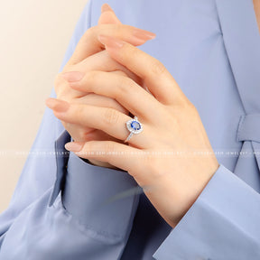 Stunning Oval Blue Sapphire and Diamond Halo White Gold Ring | Modern Gem Jewelry | Saratti