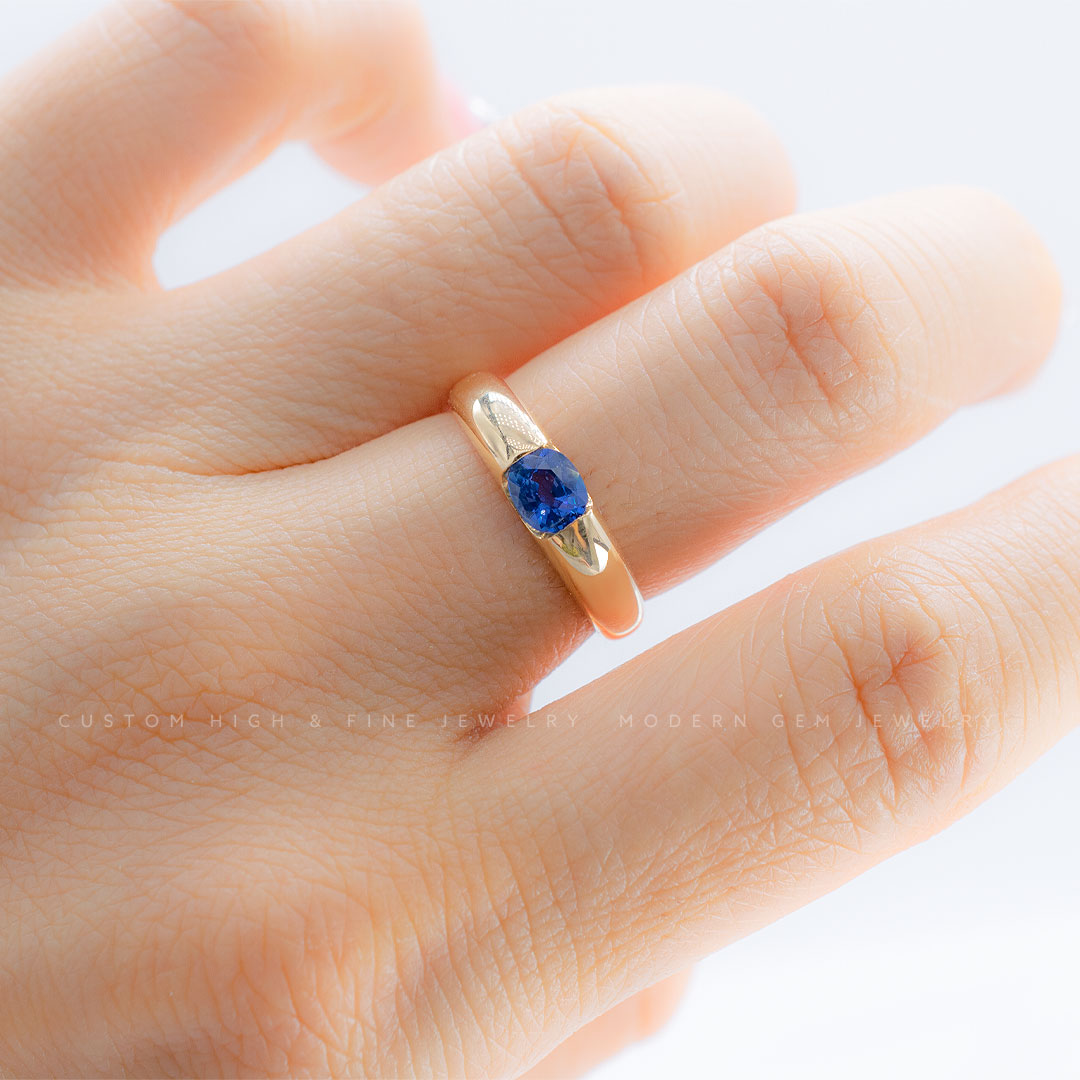 Glamorous Tension Set Blue Sapphire Ring in 18K Yellow Gold | Modern Gem Jewelry | Saratti