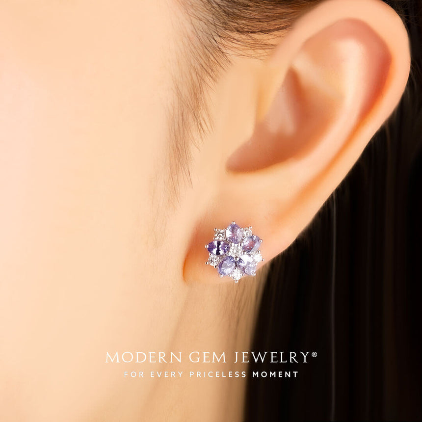 Model wears 18K white gold natural tanzanite and diamond earrings