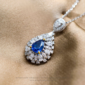 Pear Shaped Prong Held Blue Sapphire Necklace with Diamonds | Saratti