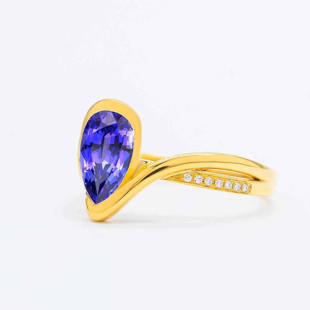 Yellow Gold Modern Pear Cut Tanzanite Engagement Ring with Diamonds - Unveiling the Mystique: Tanzanite, December's Mesmerizing Birthstone! | Saratti
