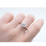 Model wears 18K White Gold Solitaire Moissanite Ring 