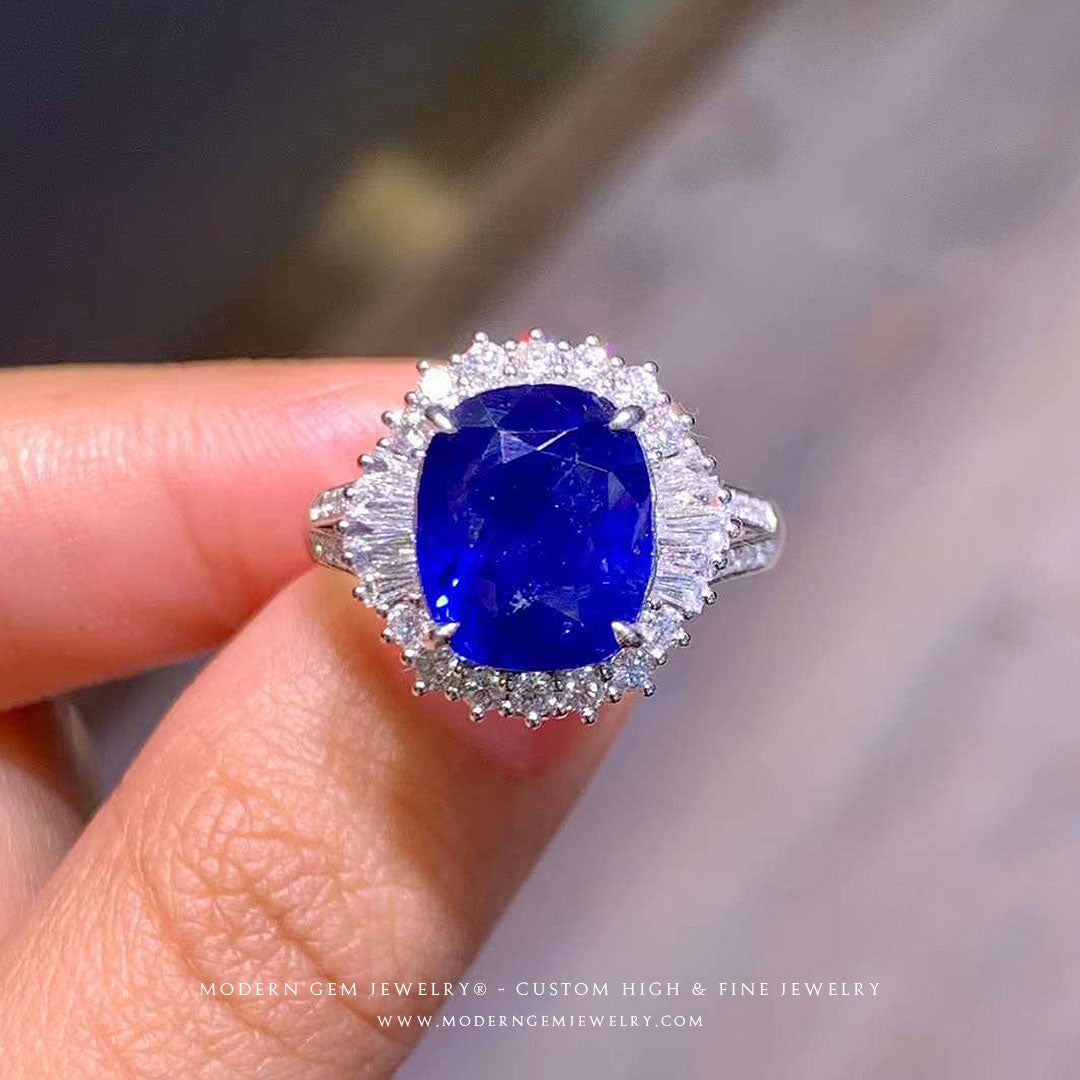 White Gold Sapphire Ring | 5 carat Unheated Cushion Royal Blue | High End Jewelry Split Shank Ring in hand | Modern Gem Jewelry